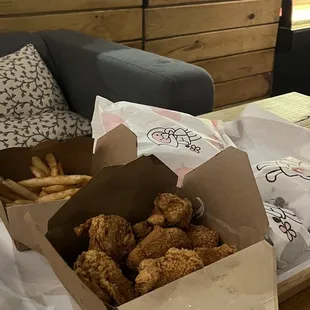 a box of fried chicken and french fries