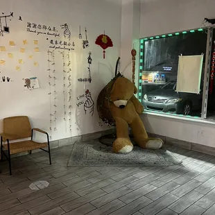 a teddy bear in a corner