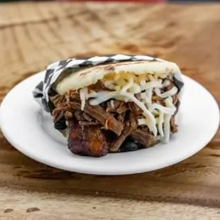 Pabellon. Carne mechada, fried sweet plantains, cheese, and black beans.