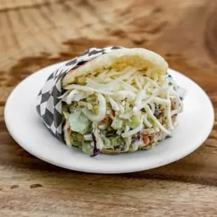 Avocado Chicken Arepa. Grilled chicken breast, avocado, lettice, mayo, light seasoning.