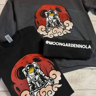 a t - shirt with an astronaut on it