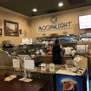 a woman standing at the counter