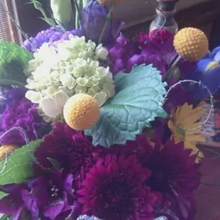 Flowers for wedding reception. The bride and groom  love Mardi Gras colors.