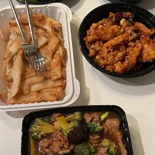 Top left clockwise: fish fillet string beans, garlic peapod sprouts, orange chicken, beef and broccoli chow fun with sauce on the side