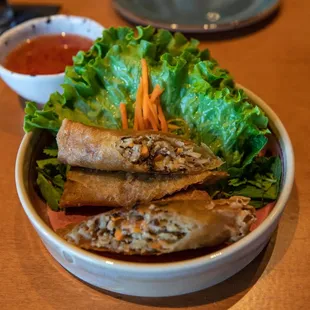 Veggie Egg Rolls - TOfu, shiitake and wood ear mushrooms, carrot, cabbage, jicama, and ginger served with a vegetarian fish sauce.