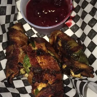 4 Boudain and Cream Cheese Stuffed Jalapenos Wrapped in Swine, Grilled and Served W/ Some Hotberry Compote