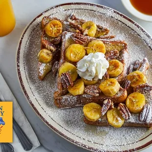 French Toast Supreme - Served with fried bananas, pecans, and whipped cream.