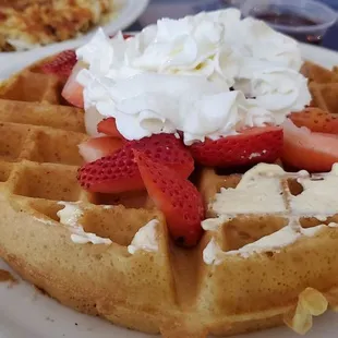 Waffle with whip cream and strawberries