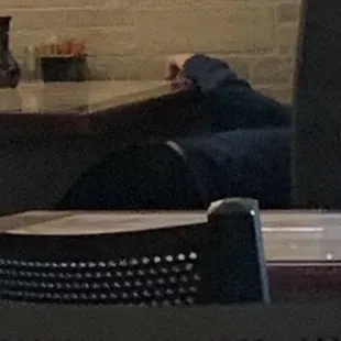 On the other side of the restaurant you see the child/family member sleeping. He was also the person they had cleaning the tables.