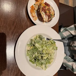 Caesar salad and loaded baked potato.