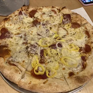 Dogfather Pizza (Dijon mustard base, pepperoni, salami, banana peppers, white onion, provolone)