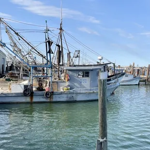 a fishing boat docked at a dock