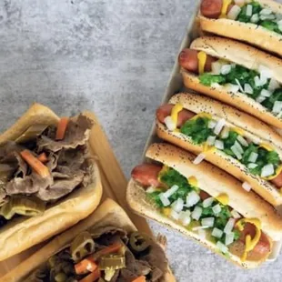 four hot dogs with various toppings