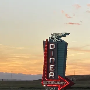 the neon sign for the diner