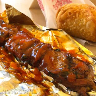 barbecue chicken on a stick and jumbo shrimp eggroll