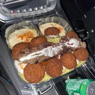 4. Falafel over Rice no Tzatziki, Double Hummus add Kafta Kabob with Garlic &amp; Spicy Sauce on top plus a side order of bread.