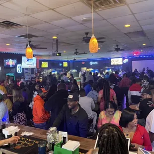 a large group of people sitting at tables