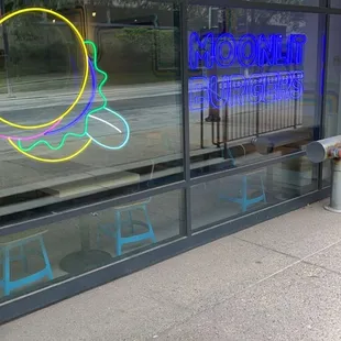 a neon sign in the window