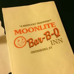 ows a napkin with the logo of the restaurant