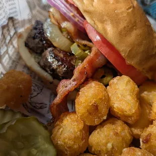 The messy burger with everything and tots. Everything was cooked to perfection and the vegetables crispy.