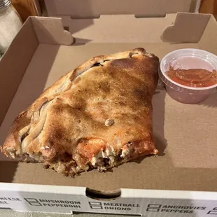 Remaining portion of my hot sausage calzone. It was massive.