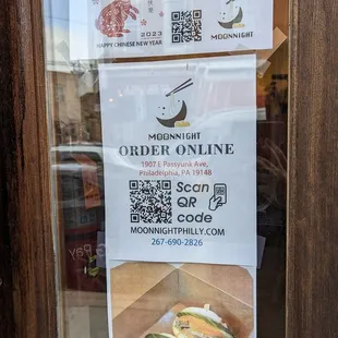 a sign in a window of a restaurant