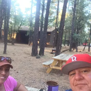 Enjoying the beautiful weather sitting out on the picnic table in front of the cabin