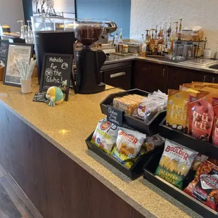 a counter with snacks and drinks