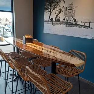 a long table with four chairs