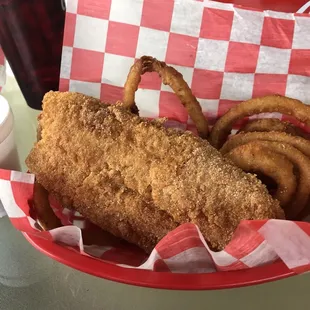 a basket of fried fish and onion rings