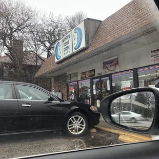 a car parked in front of the store