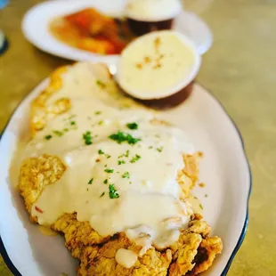 Chicken fried steak with Yukon tomatoes. Bigger than your face!
