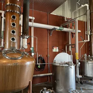 a row of copper still in a building