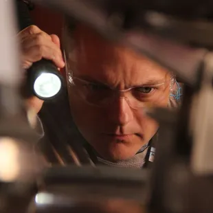 Examining the distillery equipment.