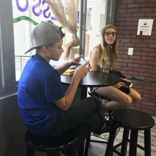 a man and a woman sitting at a table
