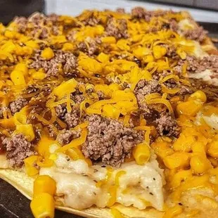 a pizza with cheese and meat