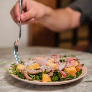 a person eating a salad