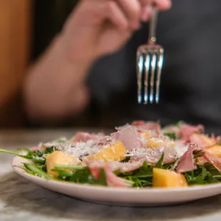 a person eating a salad