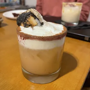 a cup of coffee with a marshmallow on top