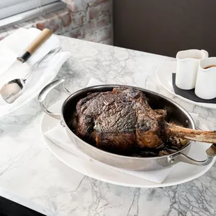 a steak in a pan on a table