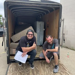 The furniture delivery guys are always ready for a task.