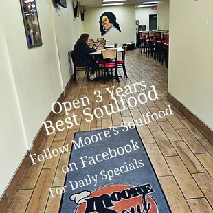 a woman sitting at a table in a restaurant