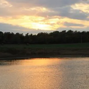 a sunset over a lake