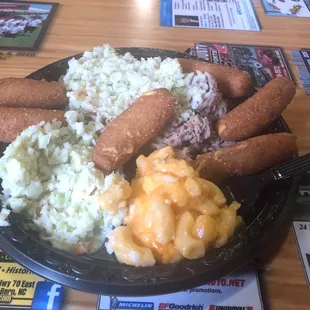 Pulled pork, house slaw, Mac and cheese, and hush puppies.