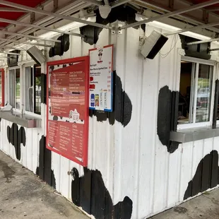 a cow painted on the side of a building