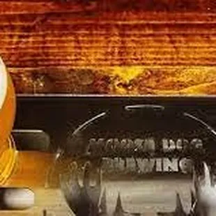 a glass of beer on a tray