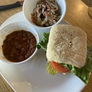 Bison burger with pepper jack cheese and mushrooms.  With a side of beans and jalapeños coleslaw