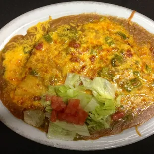 Mexican hamburger. Smothered in hot green chili