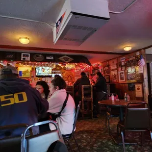 a group of people sitting at a bar