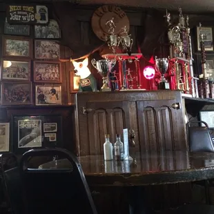 a bar with trophies on the wall